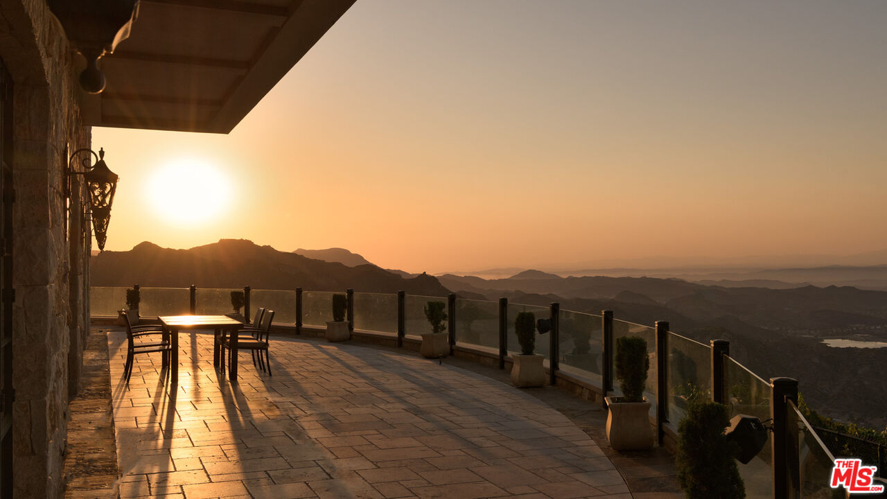 340 Kanan Dume Road Malibu, CA 90265 - Photo 46 of 57 a view of a terrace with a table and chairs