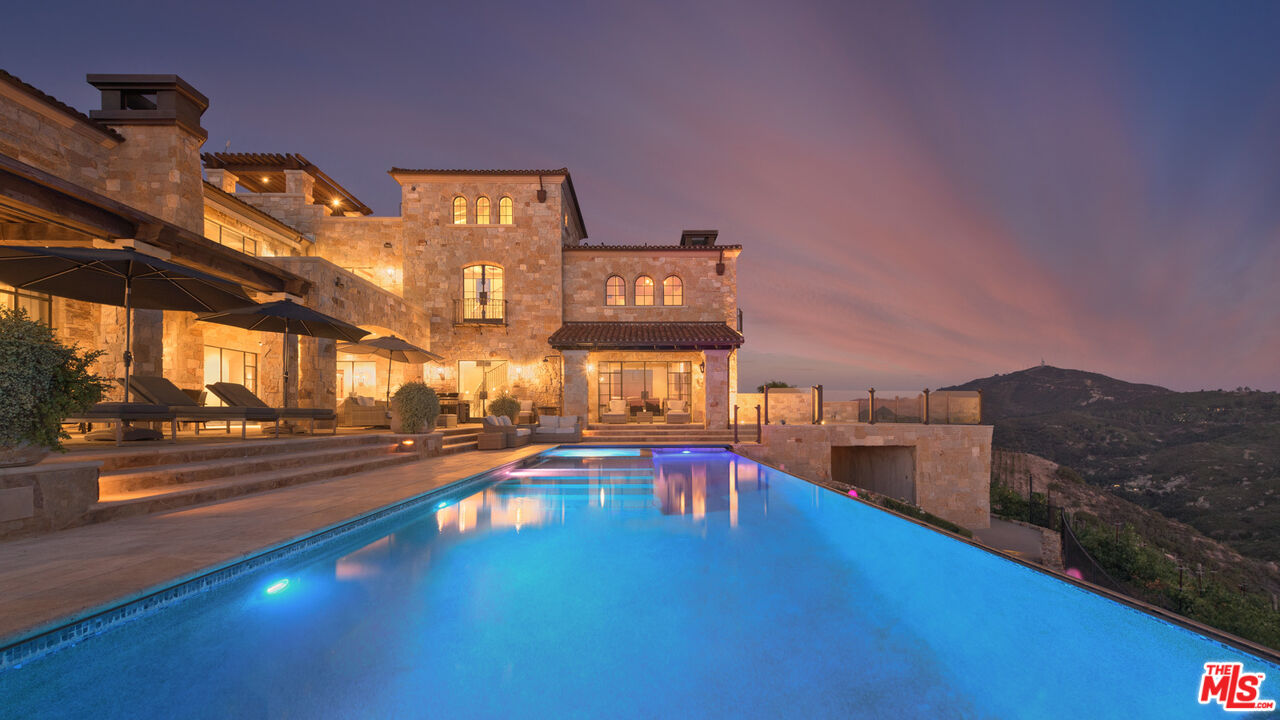340 Kanan Dume Road Malibu, CA 90265 - Photo 52 of 57 a view of a swimming pool with an outdoor seating