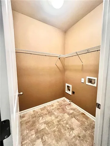 a view of a big room with wooden floor and cabinet
