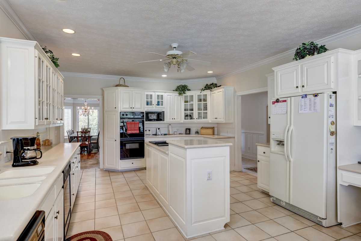 519 Maple Hill Road Lebanon, TN 37087 - Photo 14 of 49 a kitchen with refrigerator and cabinets