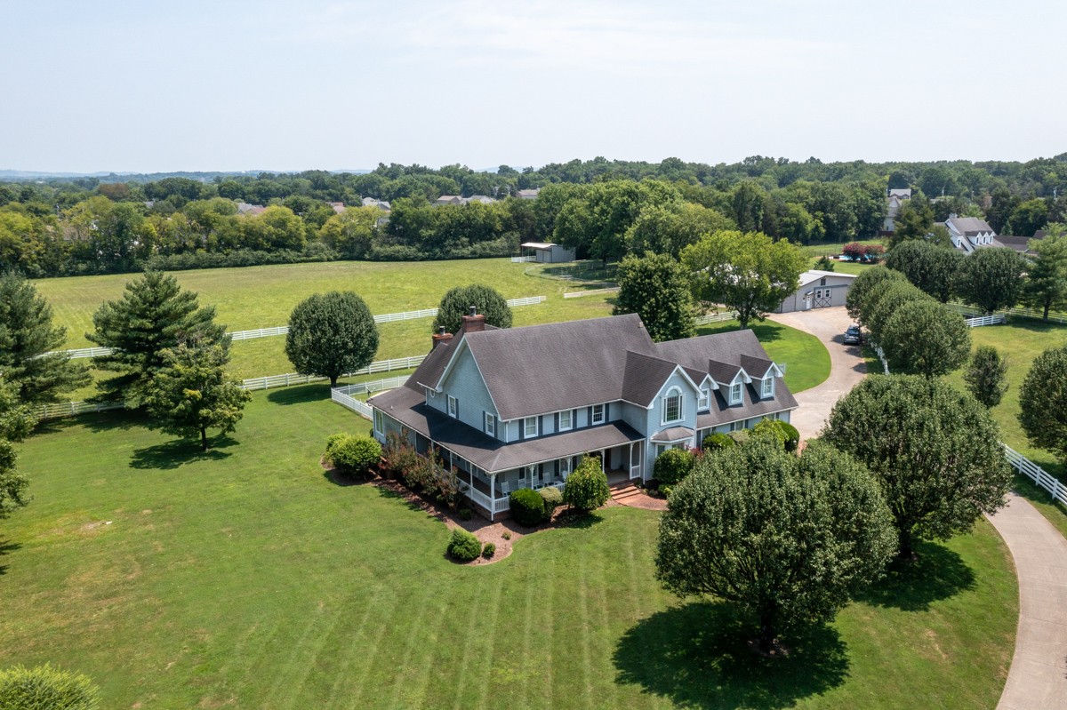 519 Maple Hill Road Lebanon, TN 37087 - Photo 3 of 49 a aerial view of a house with garden space and a lake view