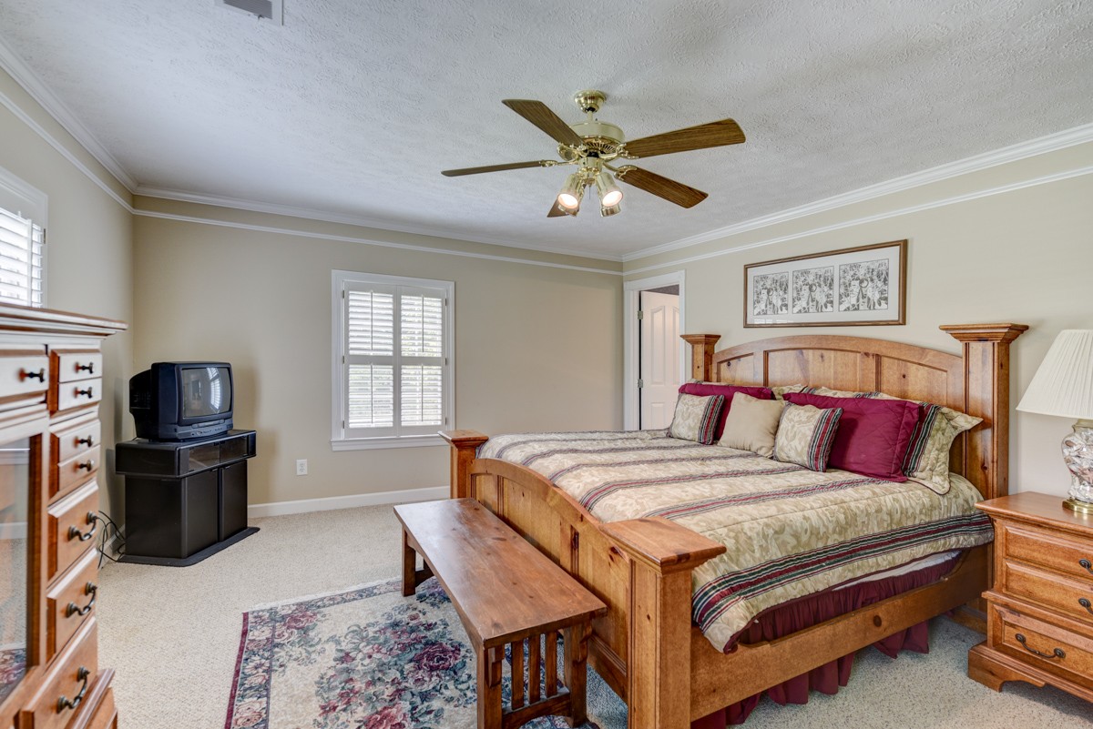519 Maple Hill Road Lebanon, TN 37087 - Photo 26 of 49 a bed room with a bed and a television