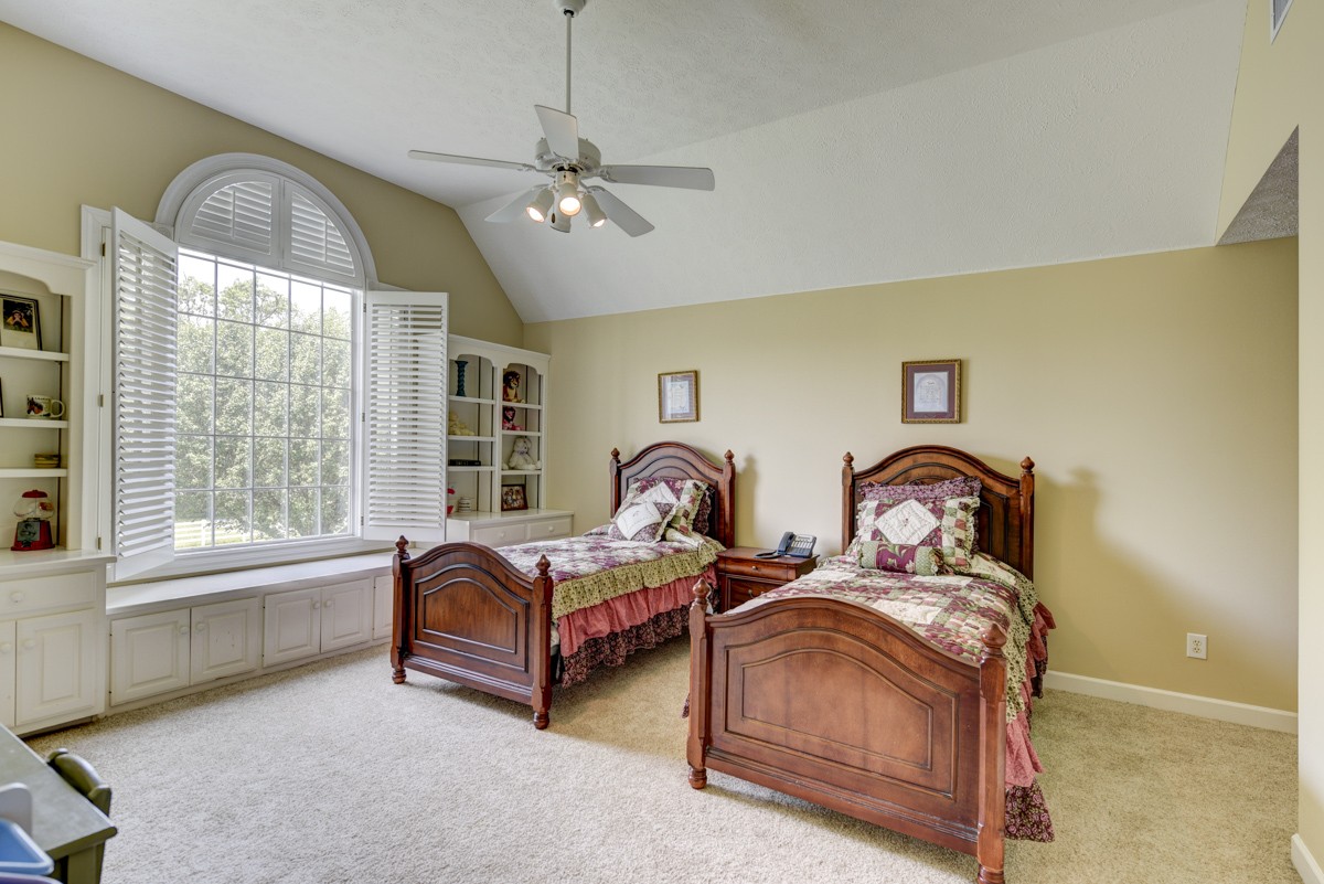 519 Maple Hill Road Lebanon, TN 37087 - Photo 28 of 49 a spacious bedroom with two beds and a large window