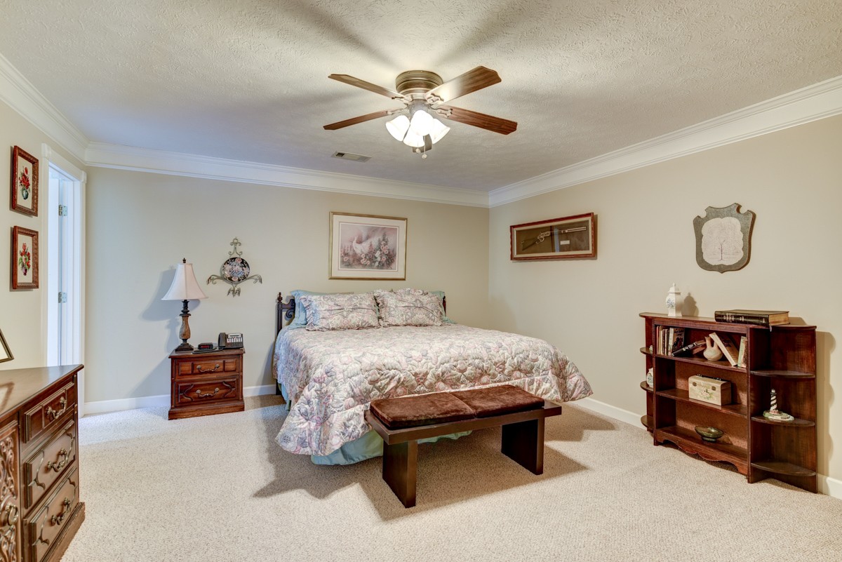 519 Maple Hill Road Lebanon, TN 37087 - Photo 30 of 49 a bedroom with a bed and dresser