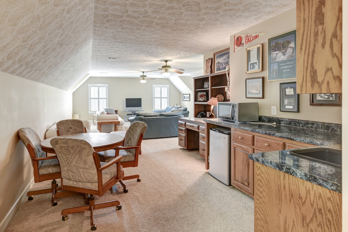 519 Maple Hill Road Lebanon, TN 37087 - Photo 32 of 49 a kitchen with stainless steel appliances kitchen island granite countertop a sink and cabinets