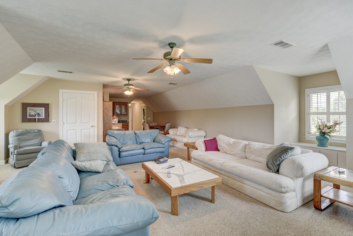 519 Maple Hill Road Lebanon, TN 37087 - Photo 33 of 49 a living room with furniture ceiling fan and a rug