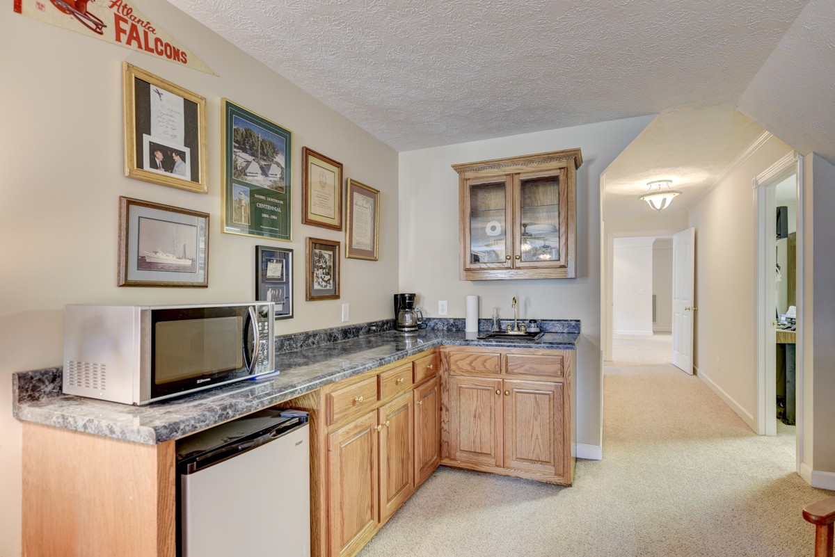 519 Maple Hill Road Lebanon, TN 37087 - Photo 34 of 49 a kitchen with granite countertop a sink stove and cabinets