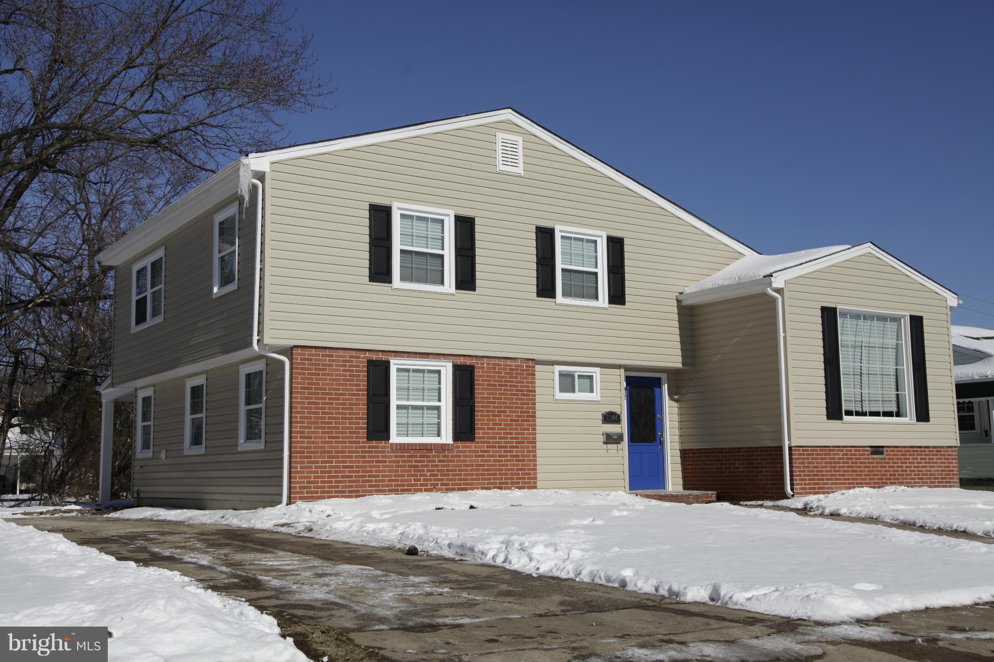 3344 Ripple Road Windsor Mill, MD 21244 - Photo 1 of 30 a front view of a house with a road