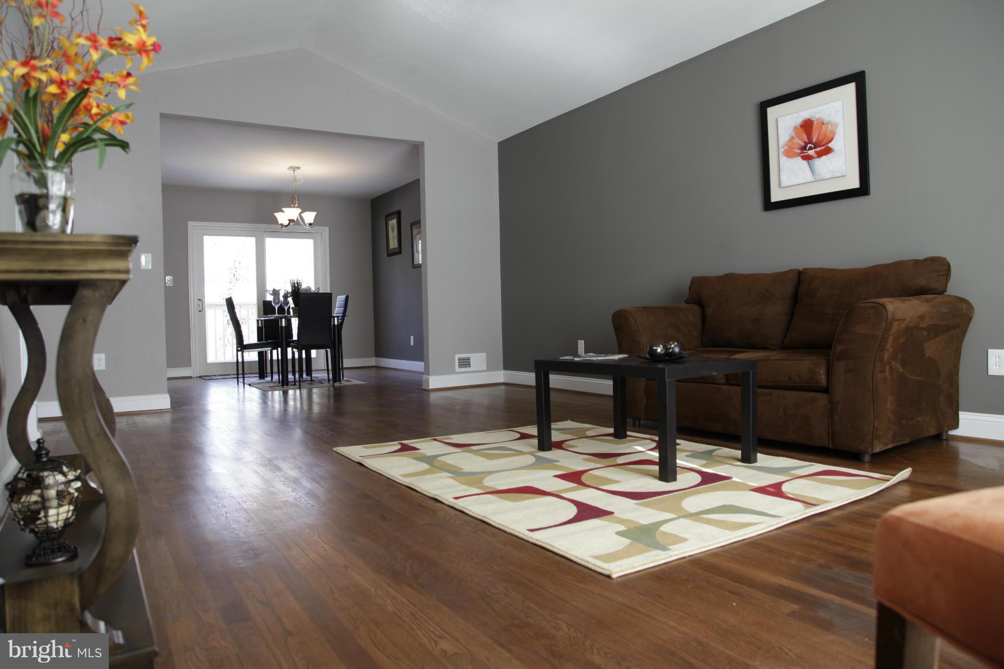 3344 Ripple Road Windsor Mill, MD 21244 - Photo 12 of 30 a view of a dining room with furniture and wooden floor