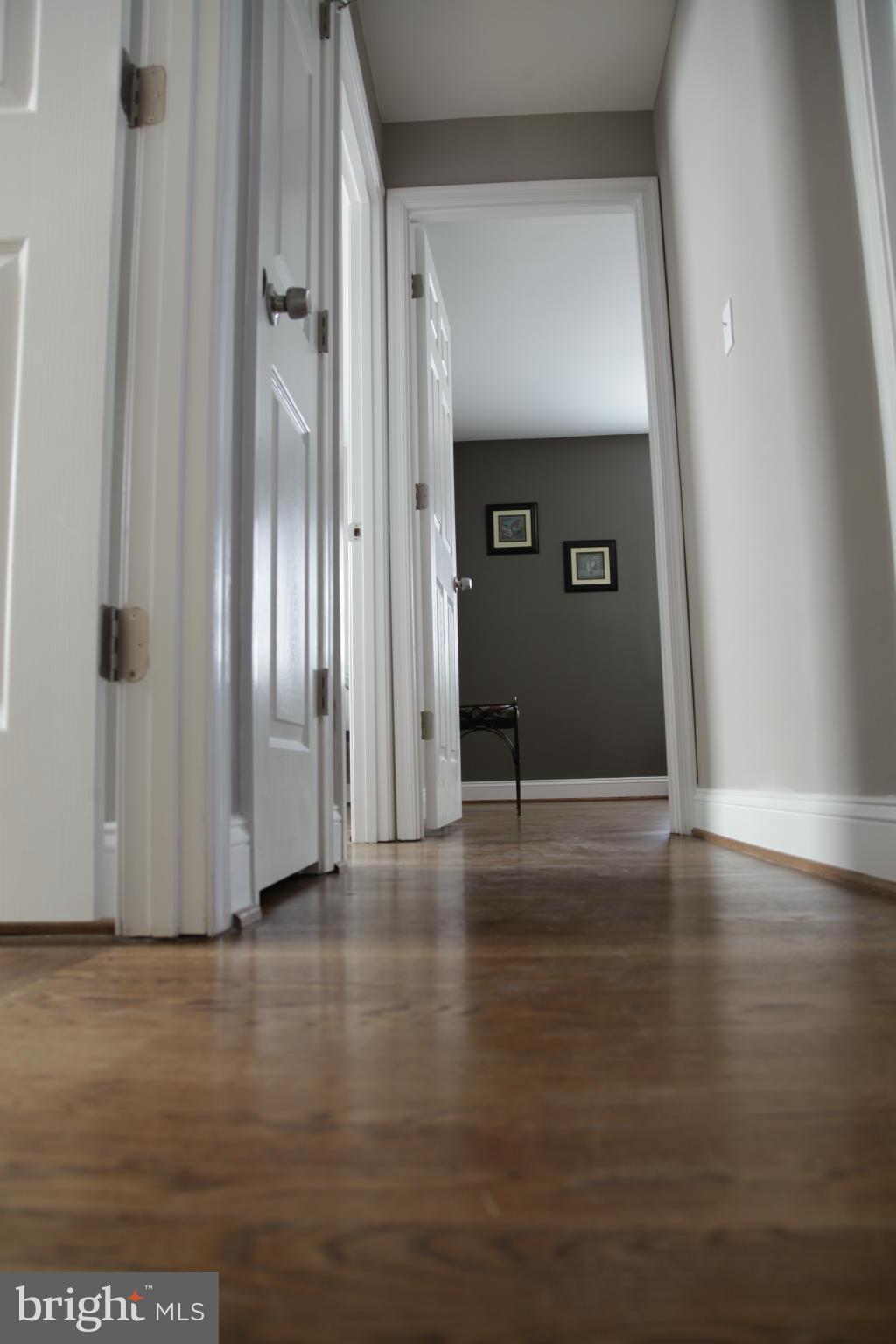 3344 Ripple Road Windsor Mill, MD 21244 - Photo 13 of 30 a view of a hallway with wooden floor