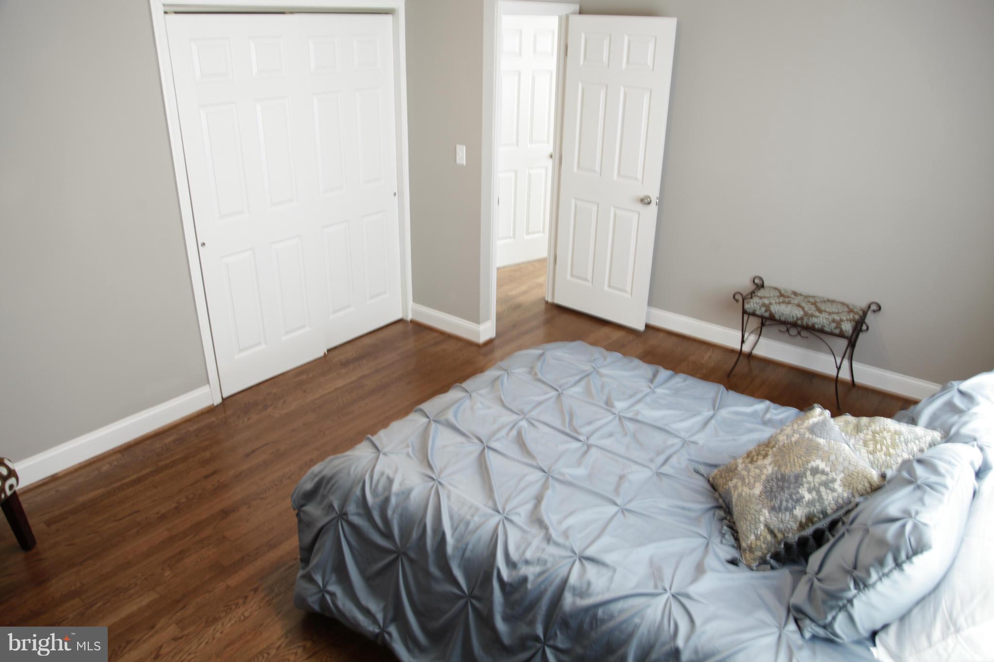 3344 Ripple Road Windsor Mill, MD 21244 - Photo 20 of 30 a bedroom with a bed and a potted plant