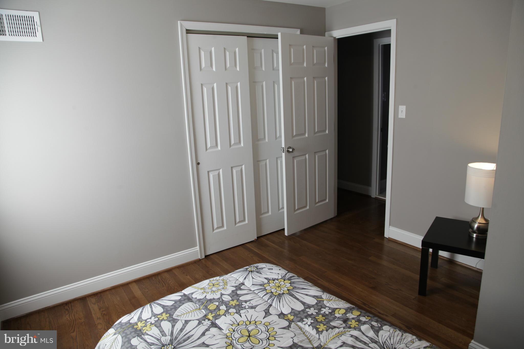 3344 Ripple Road Windsor Mill, MD 21244 - Photo 21 of 30 a bedroom with a bed and wooden floor