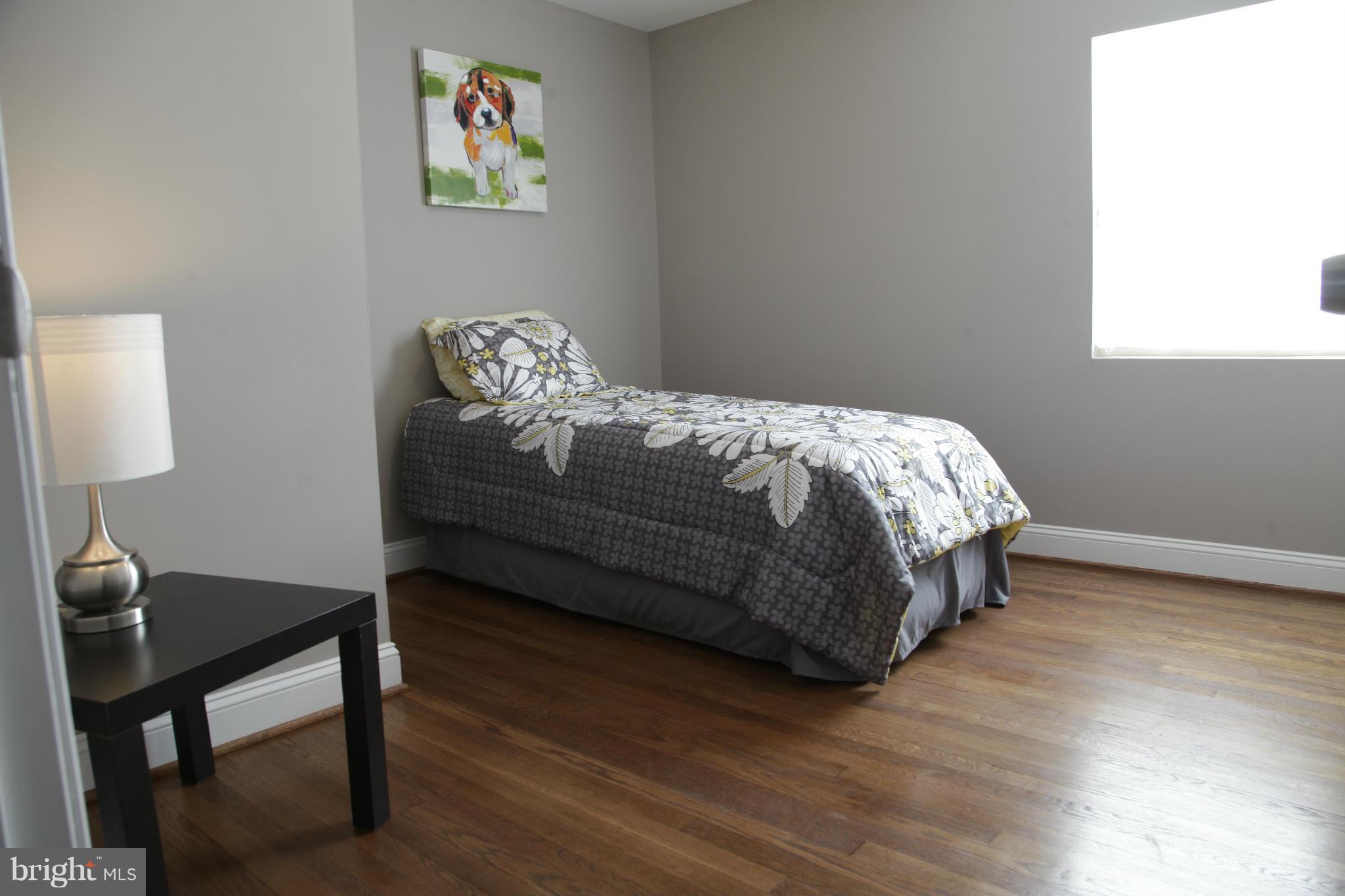 3344 Ripple Road Windsor Mill, MD 21244 - Photo 22 of 30 a bed sitting in a bedroom next to a window