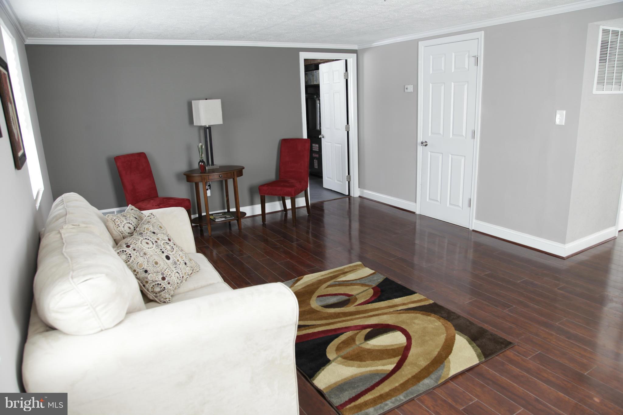 3344 Ripple Road Windsor Mill, MD 21244 - Photo 25 of 30 a living room with furniture and a wooden floor