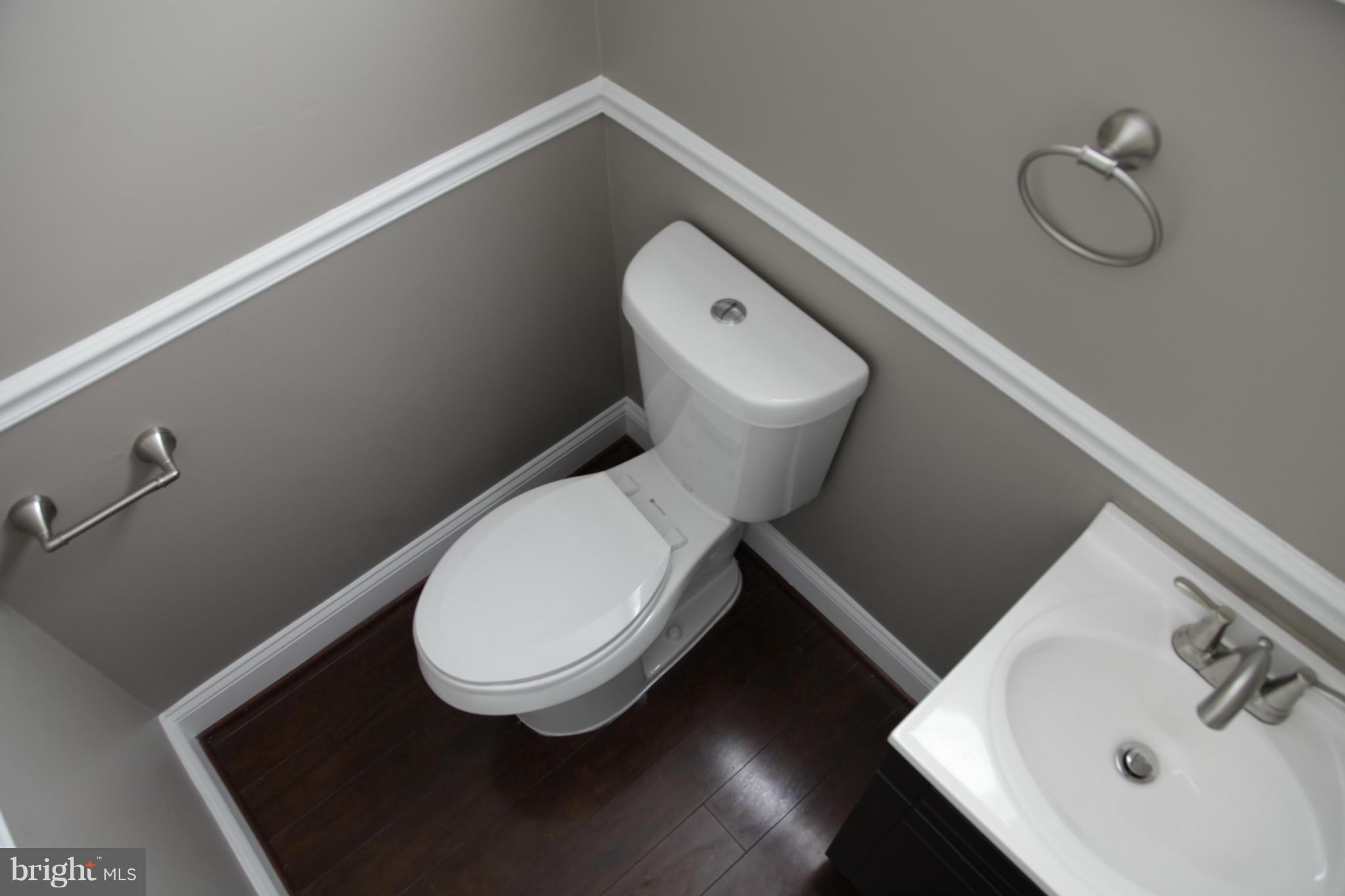3344 Ripple Road Windsor Mill, MD 21244 - Photo 26 of 30 a bathroom with a toilet and a sink