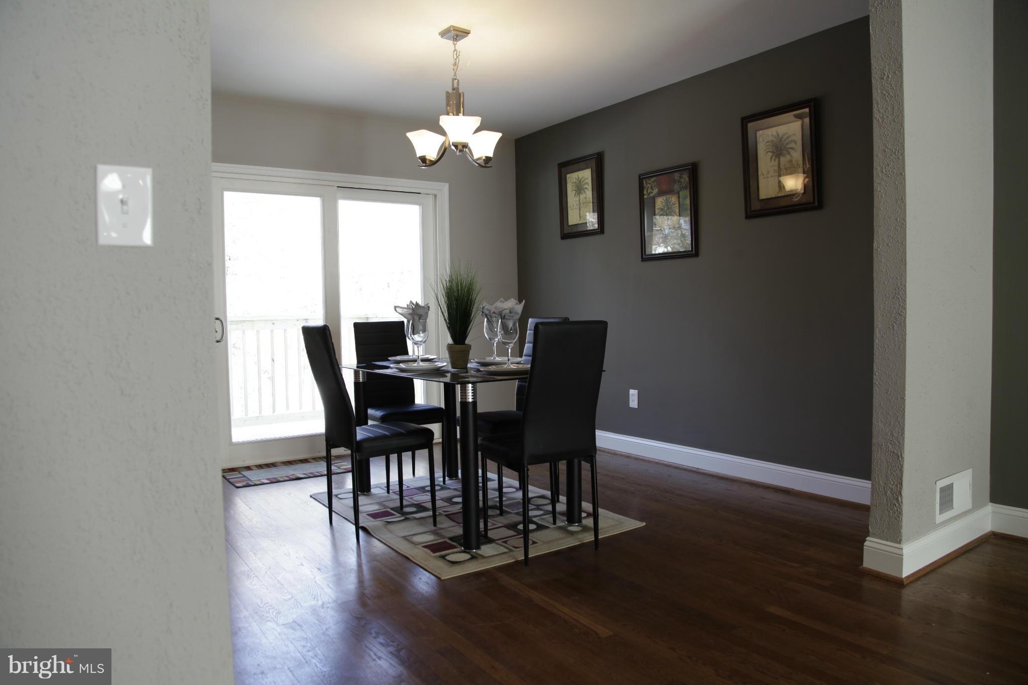 3344 Ripple Road Windsor Mill, MD 21244 - Photo 9 of 30 a view of a dining room with furniture and wooden floor