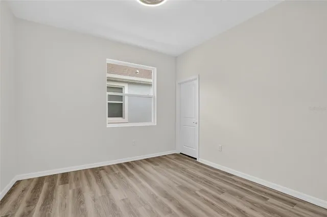 a view of a field with trees