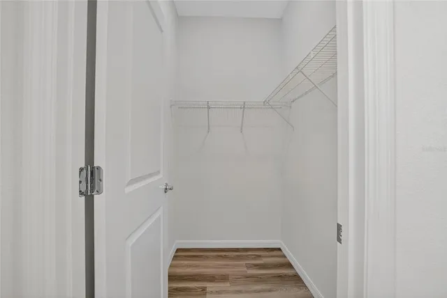 a view of a house with backyard and garden