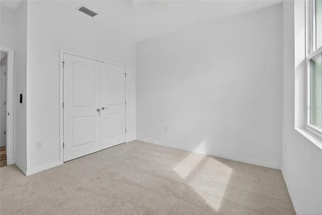 a view of a glass door with a balcony