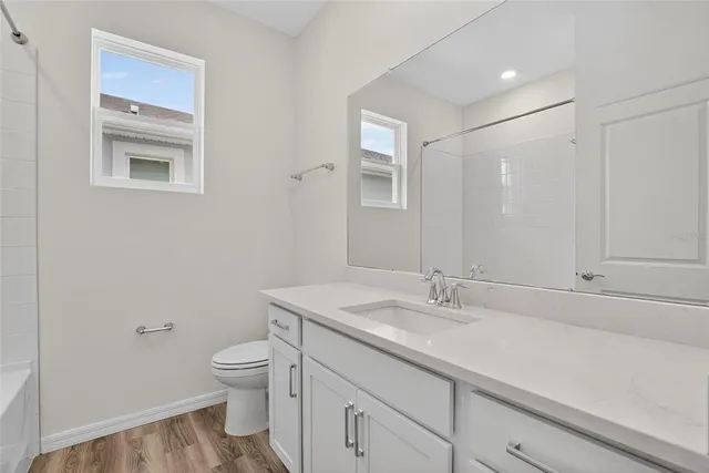 a front view of a house with white walls