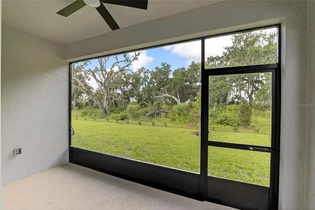 a front view of a house with a garden and plants