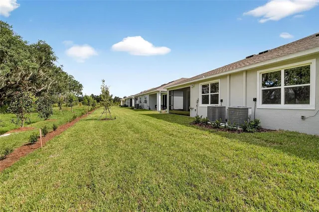 an aerial view of residential house with outdoor space and swimming pool