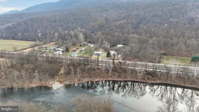 a view of swimming pool of water with outdoor seating
