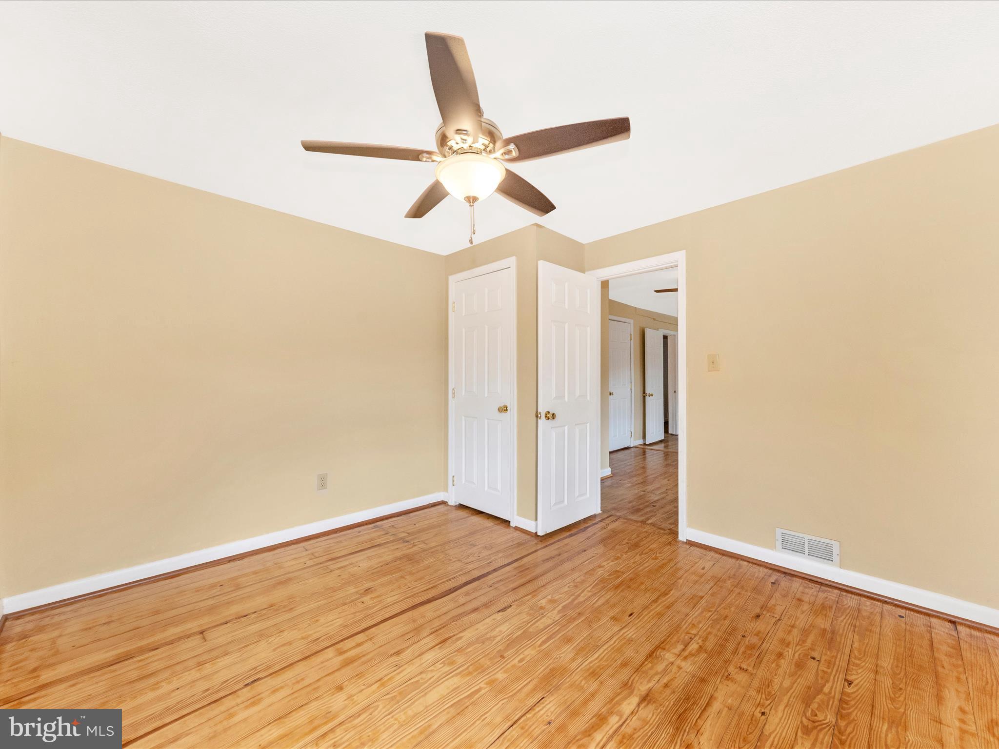 6 Myers Trail Berkeley Springs, WV 25411 - Photo 17 of 39 a view of a room with wooden floor and ceiling fan