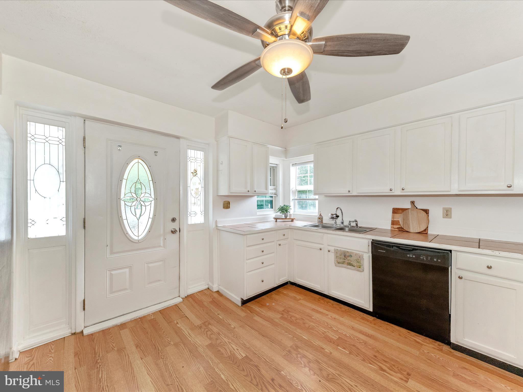 6 Myers Trail Berkeley Springs, WV 25411 - Photo 2 of 39 a large kitchen with cabinets wooden floor and stainless steel appliances
