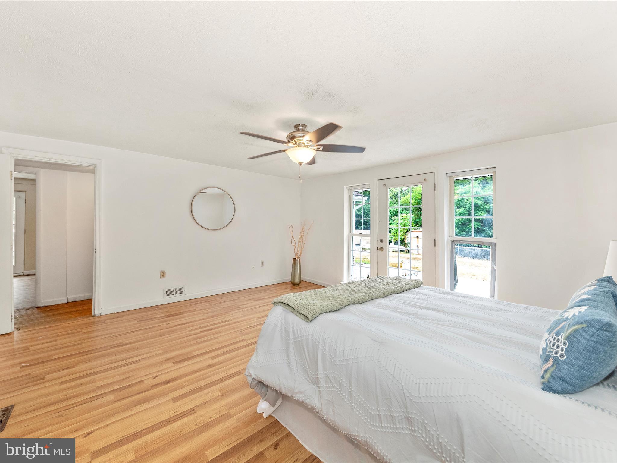 6 Myers Trail Berkeley Springs, WV 25411 - Photo 21 of 39 a bedroom with a large bed and a window