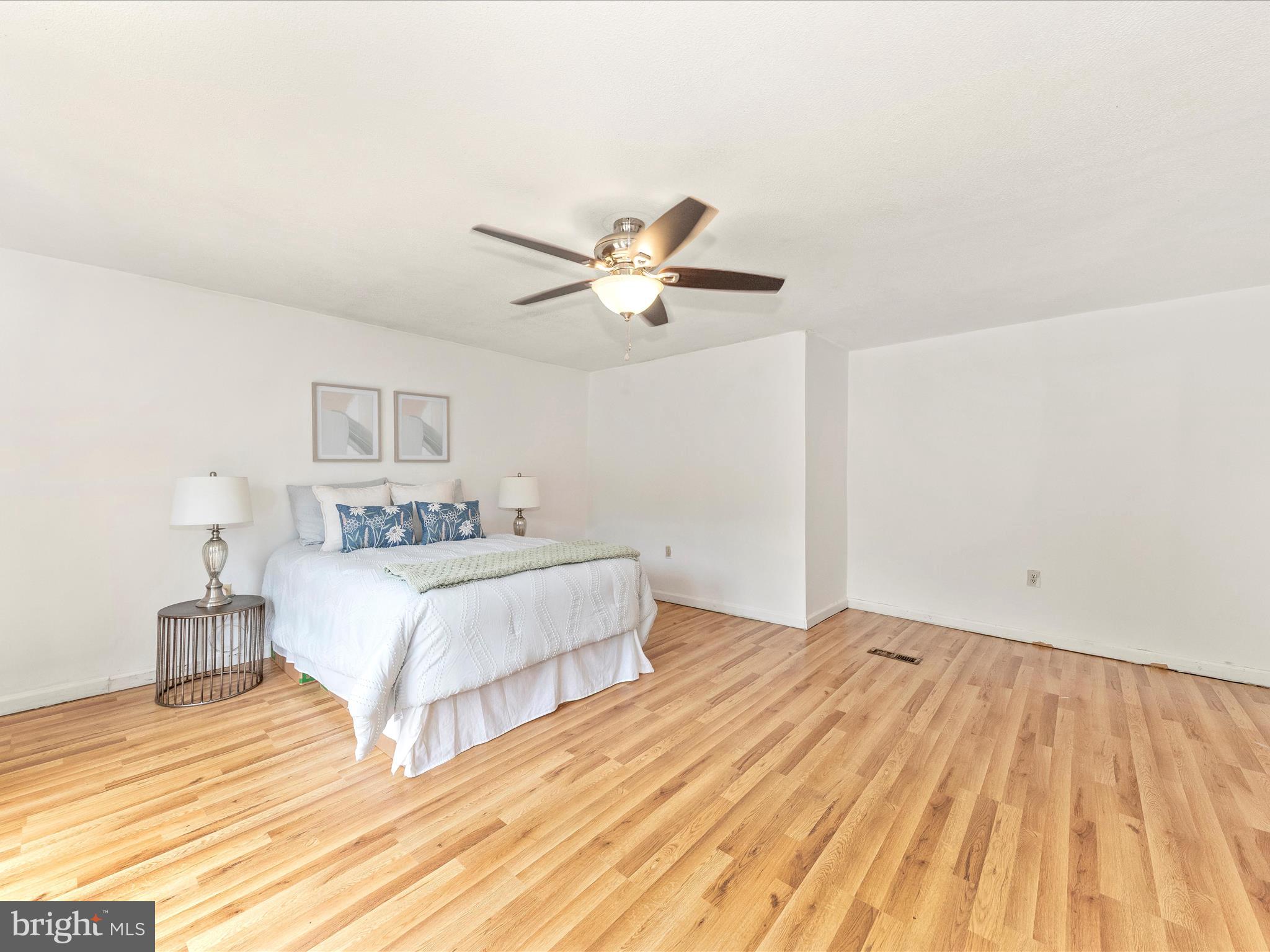 6 Myers Trail Berkeley Springs, WV 25411 - Photo 22 of 39 a bedroom with a bed and a ceiling fan
