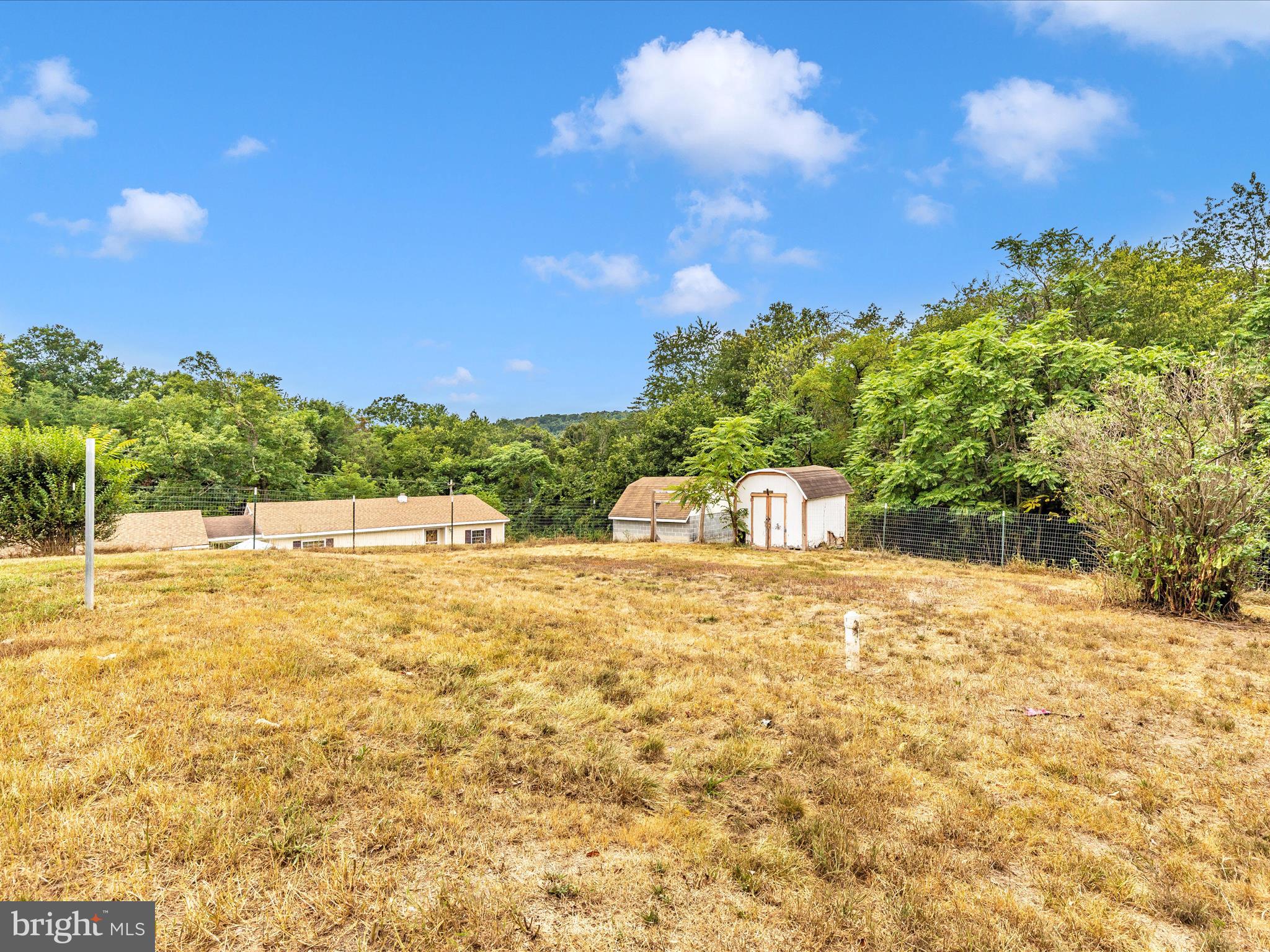 6 Myers Trail Berkeley Springs, WV 25411 - Photo 33 of 39 a swimming pool with trees in the background