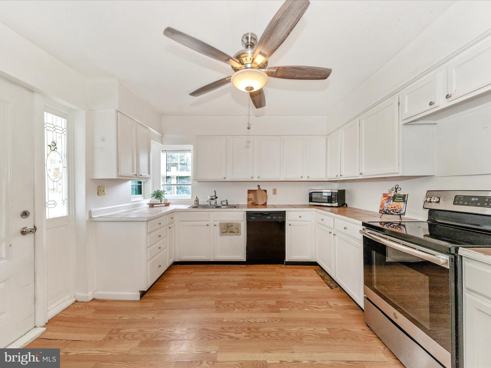6 Myers Trail Berkeley Springs, WV 25411 - Photo 4 of 39 a kitchen with a cabinets stainless steel appliances and a window