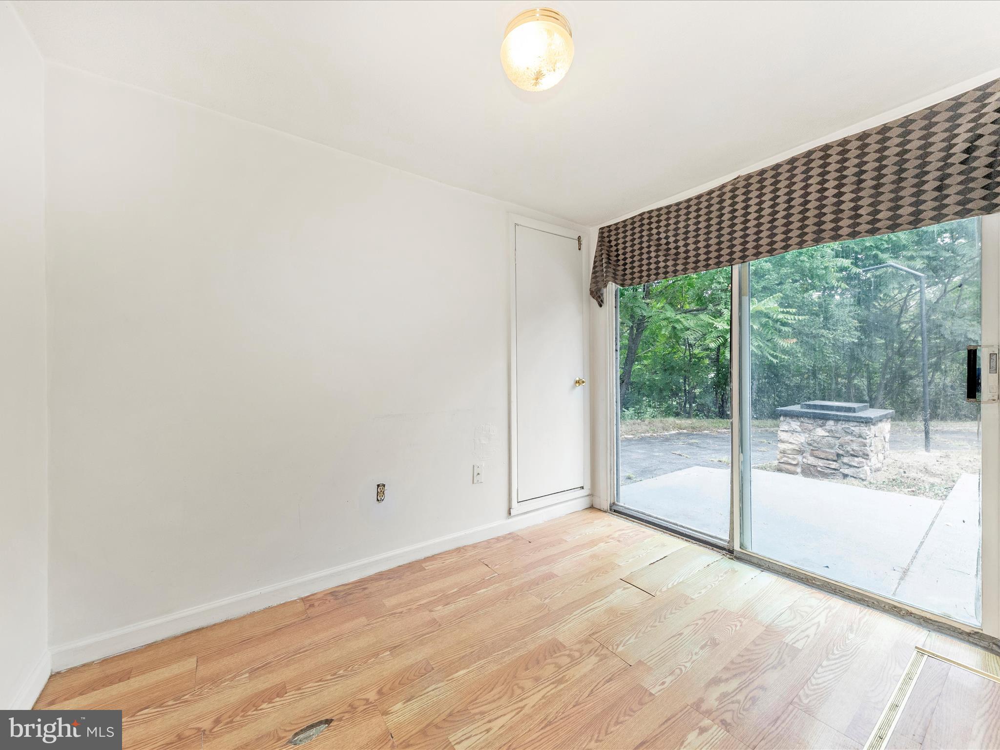 6 Myers Trail Berkeley Springs, WV 25411 - Photo 10 of 39 a view of a room with wooden floor and windows