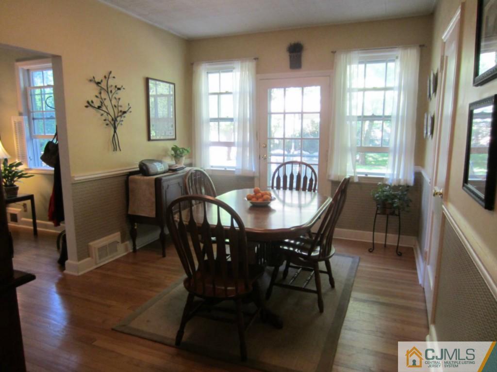 4 Edgebrook Road New Brunswick, NJ 08901 - Photo 2 of 22 a view of a dining room with furniture and wooden floor