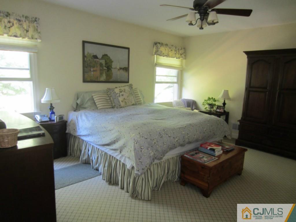 4 Edgebrook Road New Brunswick, NJ 08901 - Photo 13 of 22 a bedroom with a bed and wooden floor