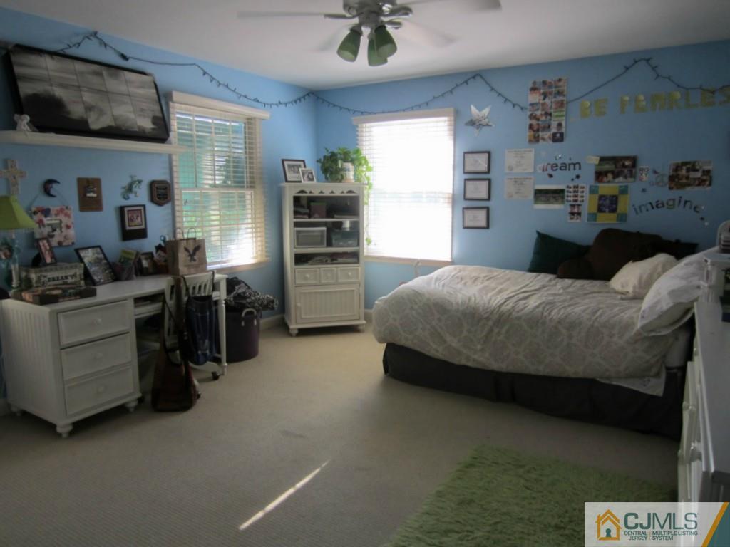4 Edgebrook Road New Brunswick, NJ 08901 - Photo 17 of 22 a bedroom with a bed and dresser
