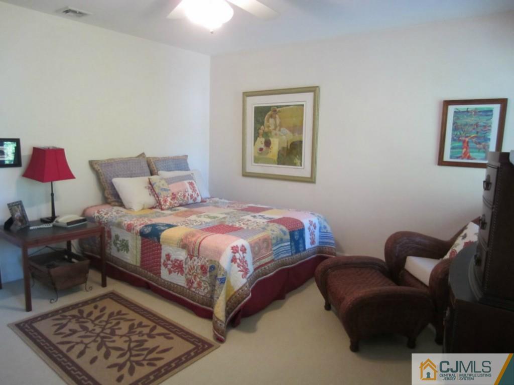 4 Edgebrook Road New Brunswick, NJ 08901 - Photo 18 of 22 a bedroom with bed and a couch