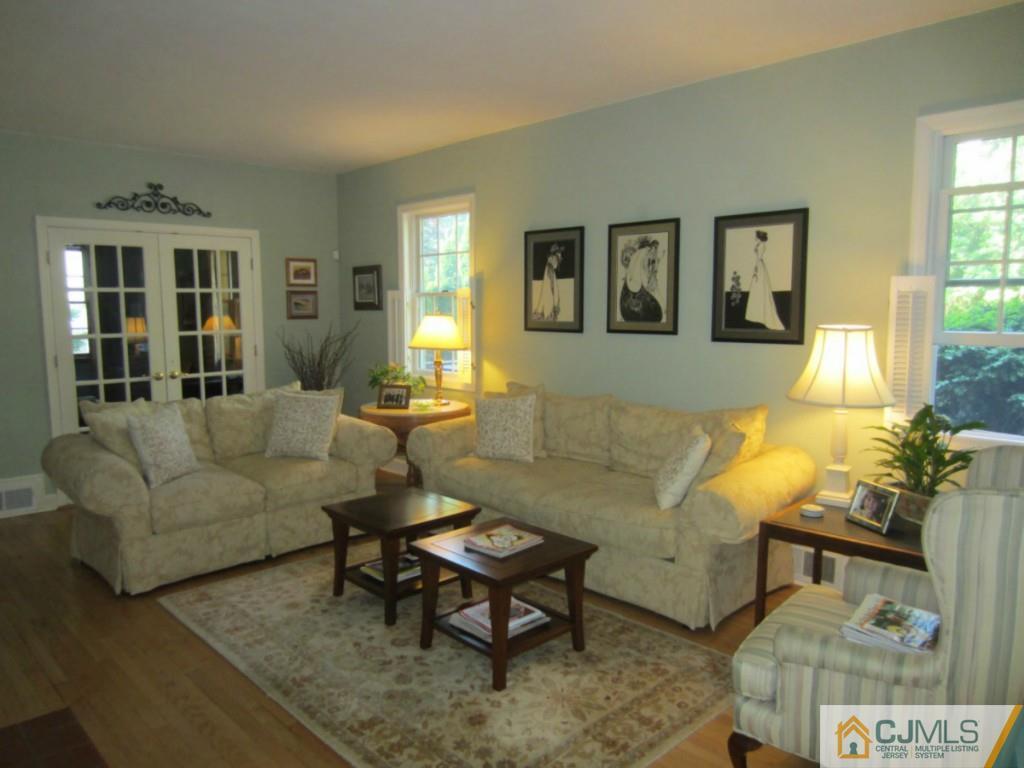 4 Edgebrook Road New Brunswick, NJ 08901 - Photo 3 of 22 a living room with furniture and a potted plant