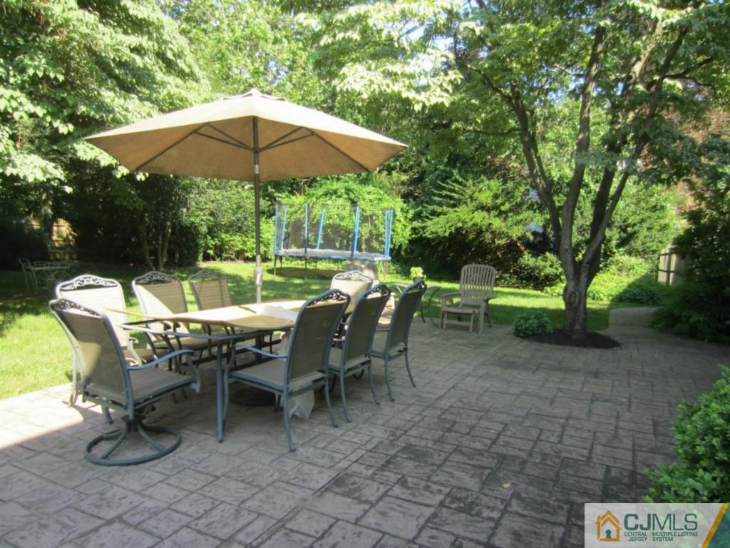 4 Edgebrook Road New Brunswick, NJ 08901 - Photo 21 of 22 a view of a chairs and table under an umbrella