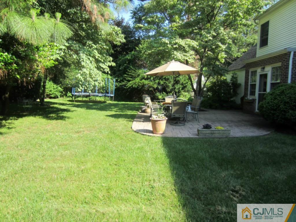 4 Edgebrook Road New Brunswick, NJ 08901 - Photo 22 of 22 a backyard of a house with table and chairs