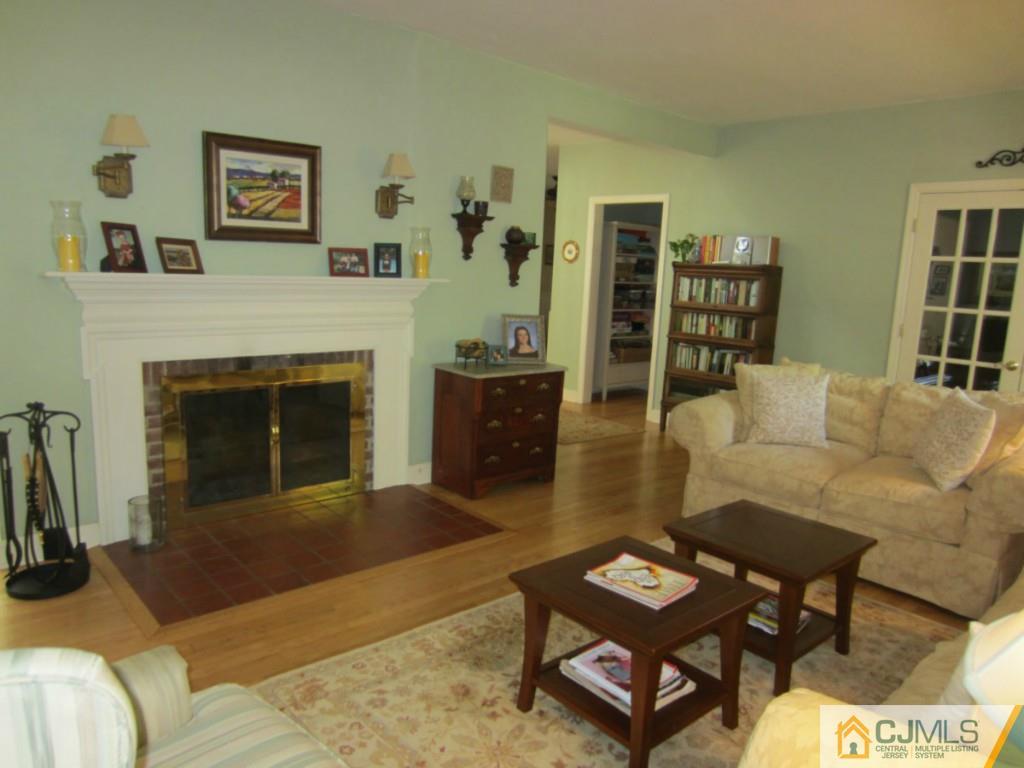 4 Edgebrook Road New Brunswick, NJ 08901 - Photo 4 of 22 a living room with furniture and a fireplace