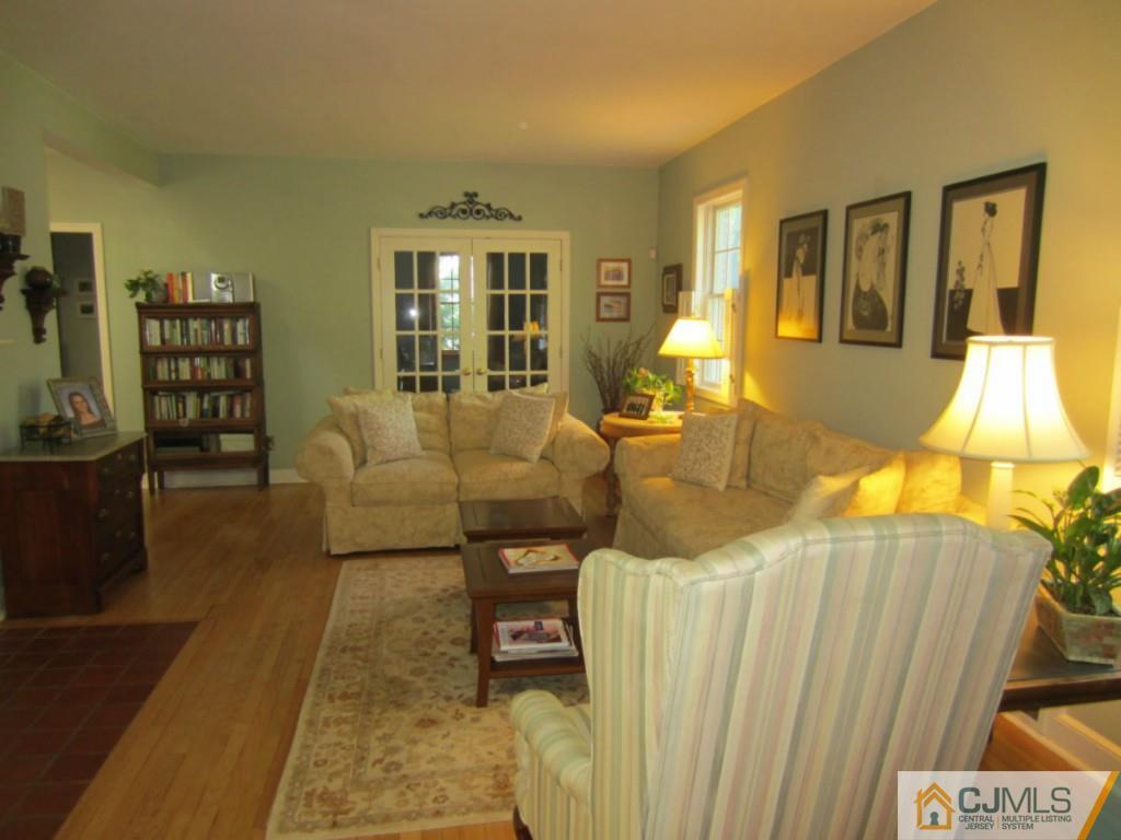 4 Edgebrook Road New Brunswick, NJ 08901 - Photo 5 of 22 a living room with furniture a window and a flat screen tv