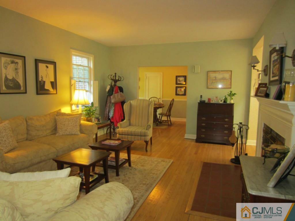 4 Edgebrook Road New Brunswick, NJ 08901 - Photo 6 of 22 a living room with furniture and a fireplace