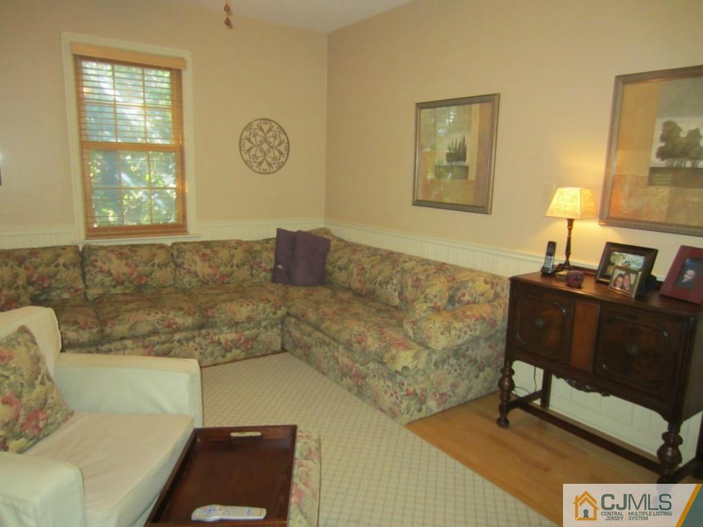 4 Edgebrook Road New Brunswick, NJ 08901 - Photo 9 of 22 a living room with couch and a window