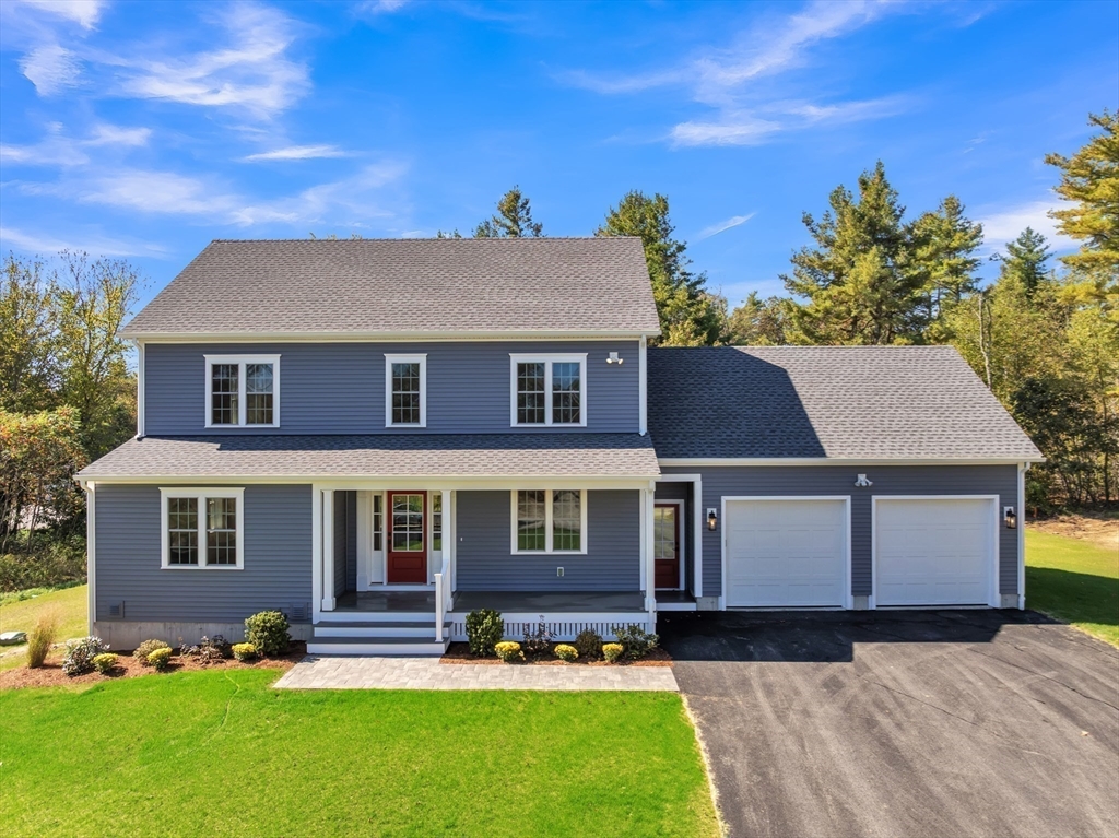 271 Glenwood Road Rutland, MA 01543 - Photo 1 of 36 a front view of a house with a yard