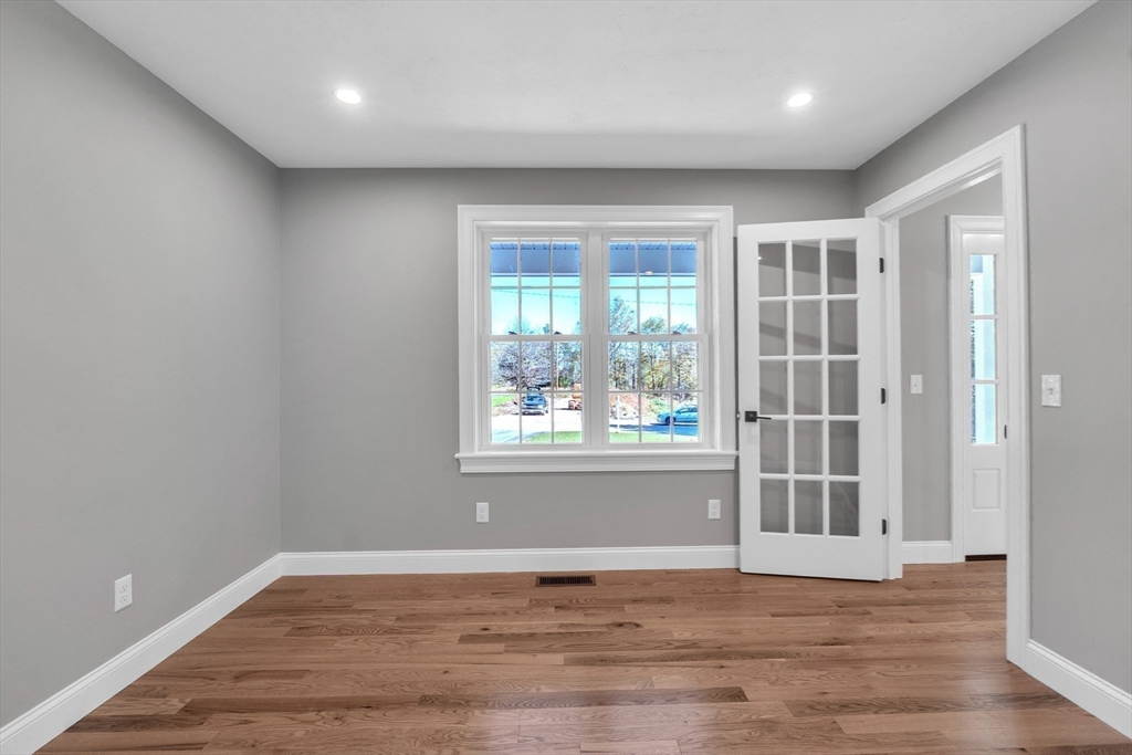 271 Glenwood Road Rutland, MA 01543 - Photo 18 of 36 a view of an empty room with wooden floor and a window