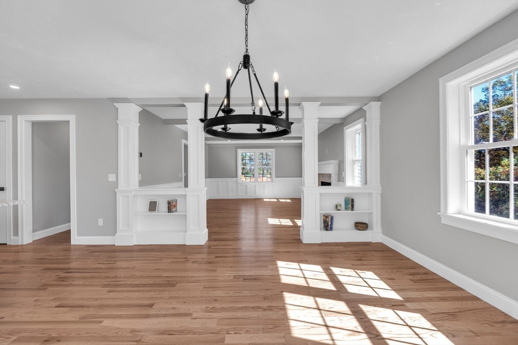 271 Glenwood Road Rutland, MA 01543 - Photo 7 of 36 a view of a hallway with wooden floor and chandelier