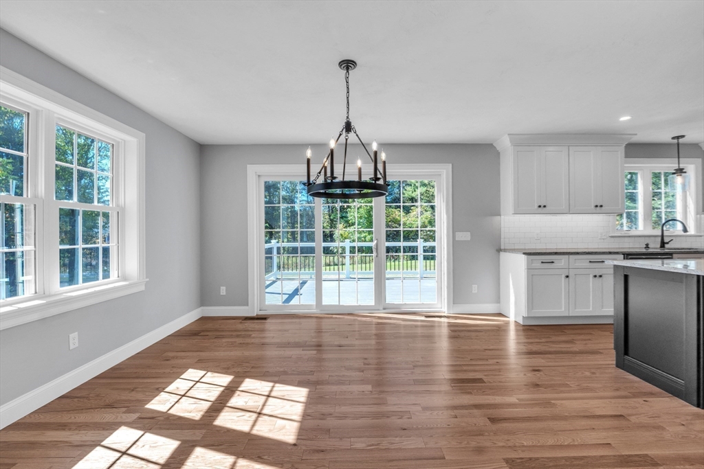 271 Glenwood Road Rutland, MA 01543 - Photo 8 of 36 a view of a kitchen with granite countertop window and wooden floor