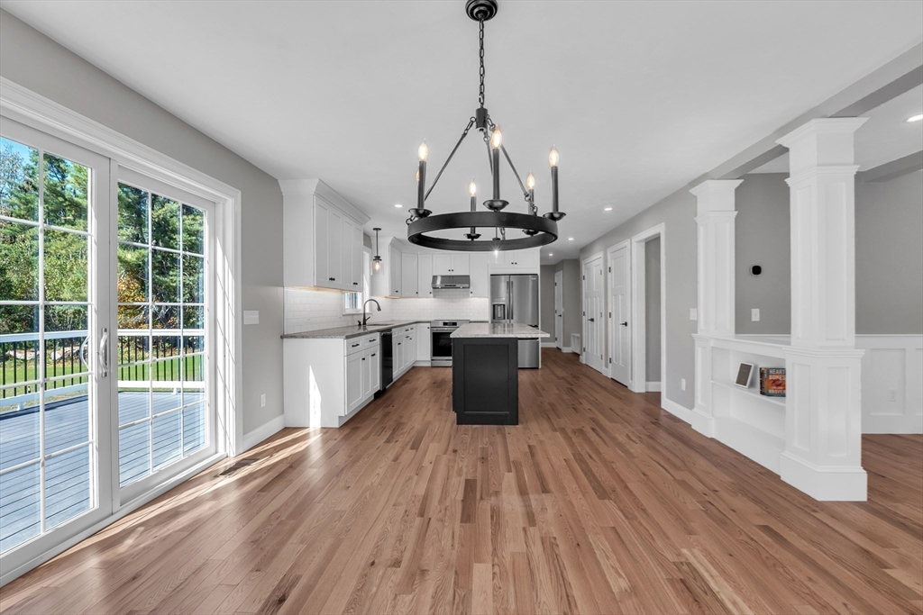 271 Glenwood Road Rutland, MA 01543 - Photo 9 of 36 a view of a kitchen with wooden floor and stainless steel appliances